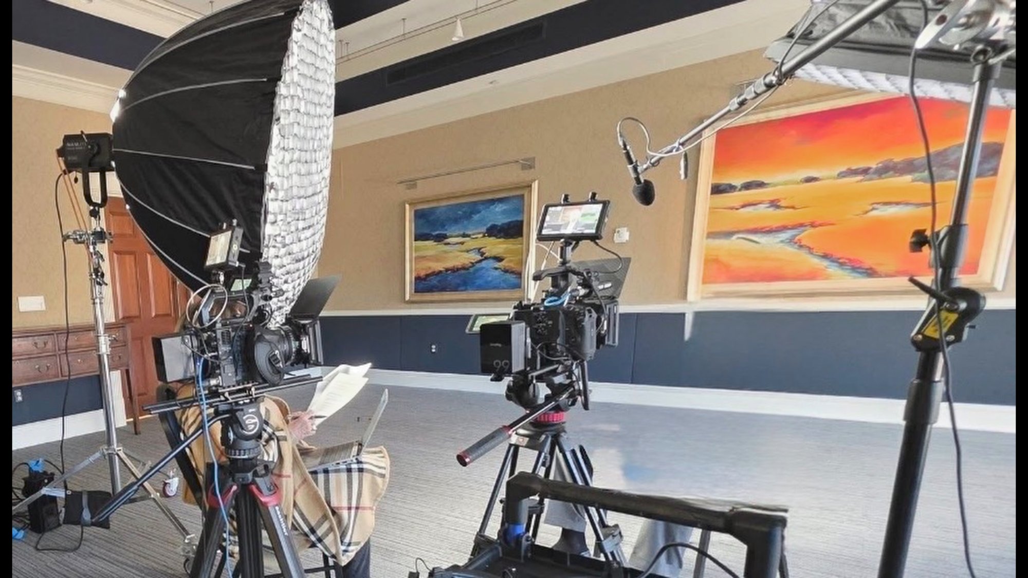 Cinema camera, softbox and teleprompter set up for a corporate interview shoot
