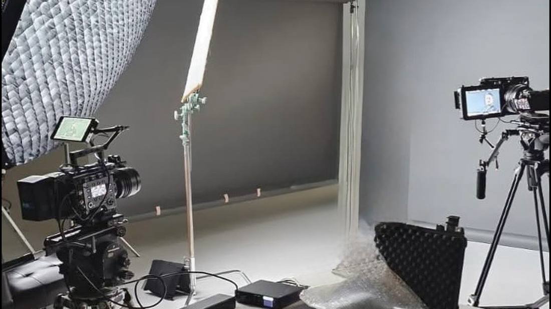 A studio lighting rig set up for a product shoot